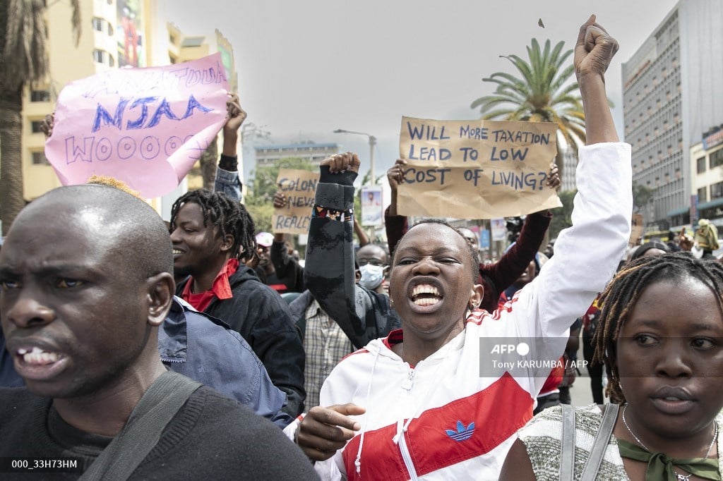 Kenyan activists march while shouting in anger during a protest over tax hike plans in Nairobi on June 6, 2023. Kenyan police fired tear gas and arrested 11 protesters during a march in Nairobi on Tuesday against a new finance bill that critics say will pile more economic hardship on ordinary people.