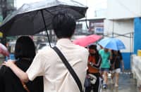 (FILE PHOTO) Walking in the rain