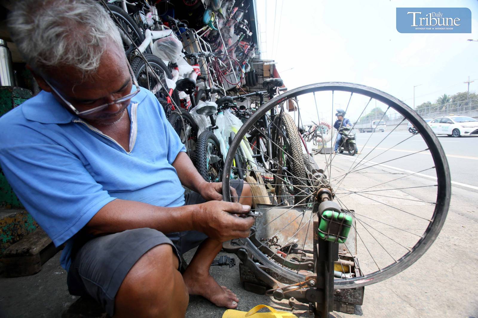 Repairing bikes during World Bicycle Day