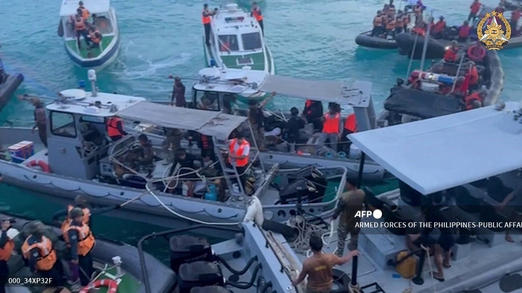 Philippines says Chinese coast guard boarded navy vessels in South China Sea
