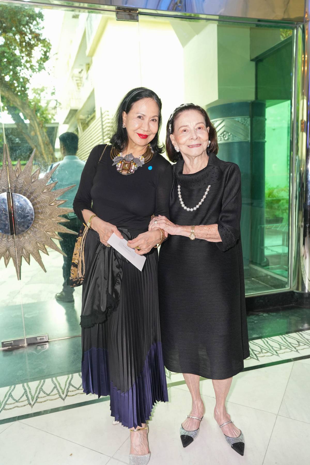 Babette Aquino Benoit and Ambassador Mercy Tuason.