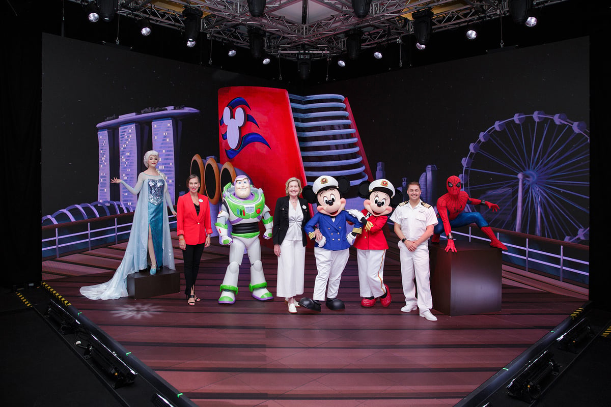 Disney Frozen’s Elsa; Sarah Fox, vice president and regional general manager, Asia, Disney Cruise Line; Buzz Lightyear from Pixar’s Toy Story; Laura Cabo, portfolio executive creative director, Walt Disney Imagineering; Captain Mickey Mouse; Captain Minnie Mouse; Lee Hawkins, cruise director, Disney Cruise Line and Marvel’s Spider-Man.