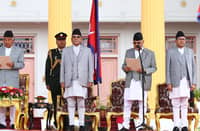 Nepal’s newly appointed prime minister Khadga Prasad Sharma Oli (second from right) takes oath of office, administered by President Ram Chandra Poudel (left) at the presidential house in Kathmandu.