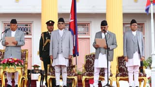 Nepal’s newly appointed prime minister Khadga Prasad Sharma Oli (second from right) takes oath of office, administered by President Ram Chandra Poudel (left) at the presidential house in Kathmandu.
