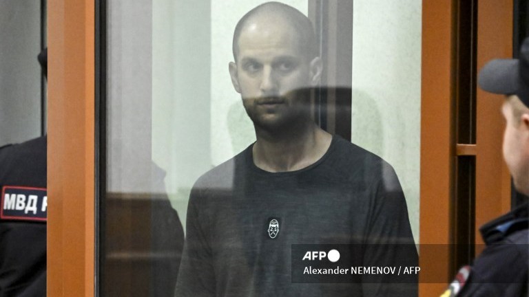 US journalist Evan Gershkovich, accused of espionage, stands inside a glass defendants' cage during the verdict announcement at the Sverdlovsk Regional Court in Yekaterinburg on July 19, 2024.