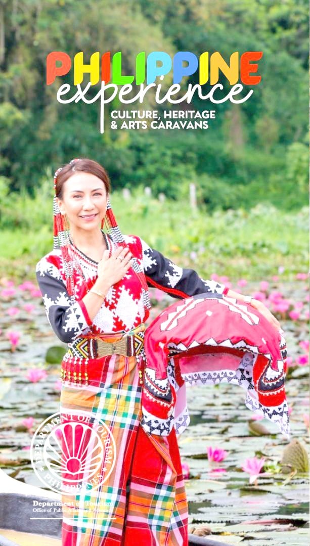 TOURISM Secretary Christina Garcia Frasco
wearing traditional tribe dress in one of the provinces
where the Philippine Experience Program: Heritage,
Culture, and Arts Caravan of the Department of
Tourism kicked off.