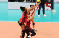 Ara Galang and import Khat Bell join hands in helping Chery Tiggo score a 25-16, 25-20, 25-23 win in the PVL Reinforced Conference at the Philsports Arena in Pasig.
