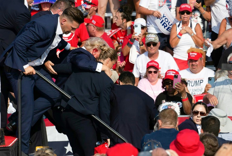 Bloodied Trump 'safe' after shots fired at rally
