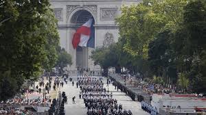 France celebrates national day as political crisis rumbles on