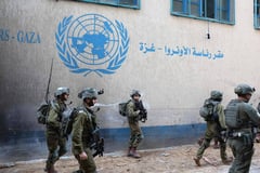 Israel forces hit Hamas fighters inside UN agency building