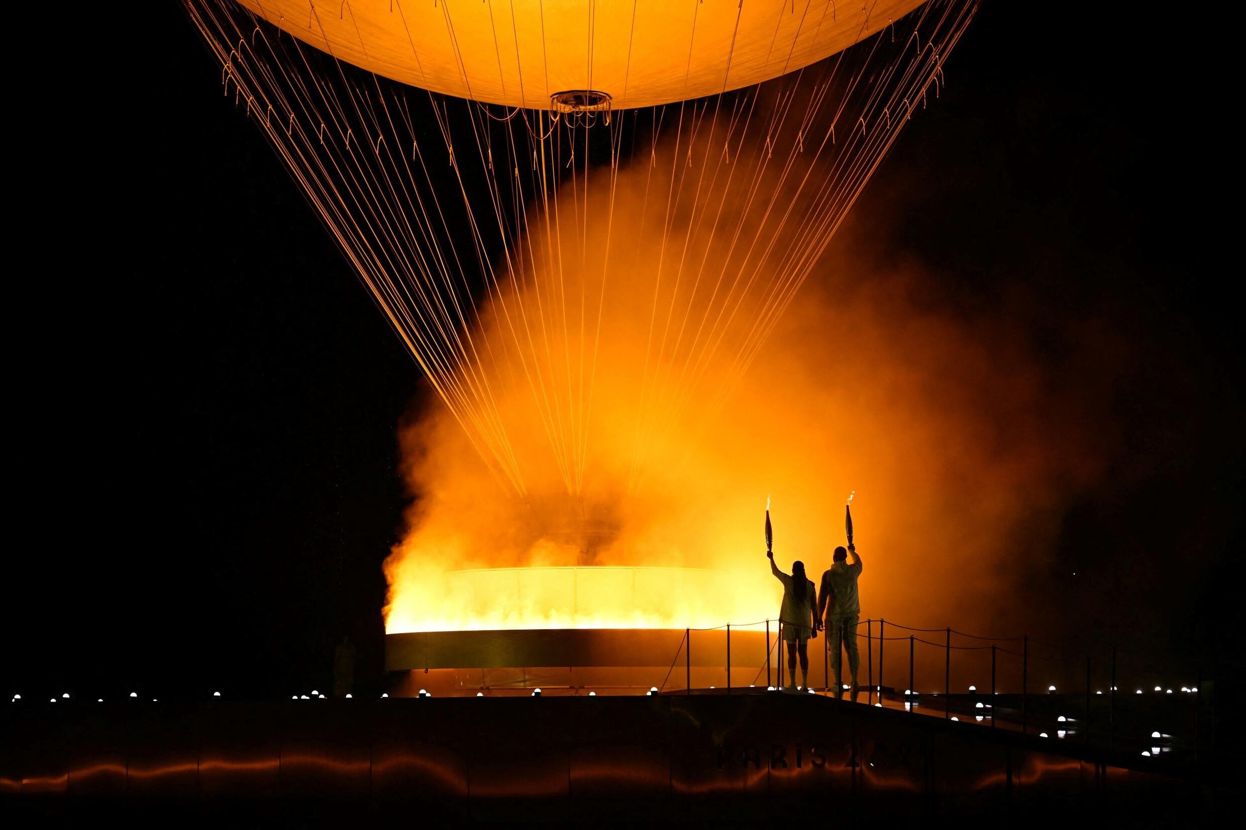 THE torchbearers in former sprinter Marie-Jose Perec and judoka Teddy Riner light the Olympic cauldron during the opening ceremony of the Paris Olympics.
