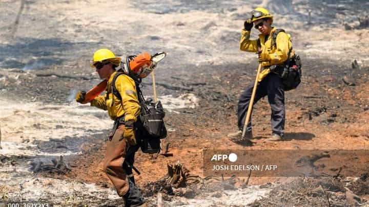 A section of Mariposa County High School burns during the French fire in Mariposa, California, in the early hours of July 5, 2024. The wildfire shut down the main highway to Yosemite National Park as red flag fire warnings and high temperatures continue throughout the state.
JOSH EDELSON / AFP