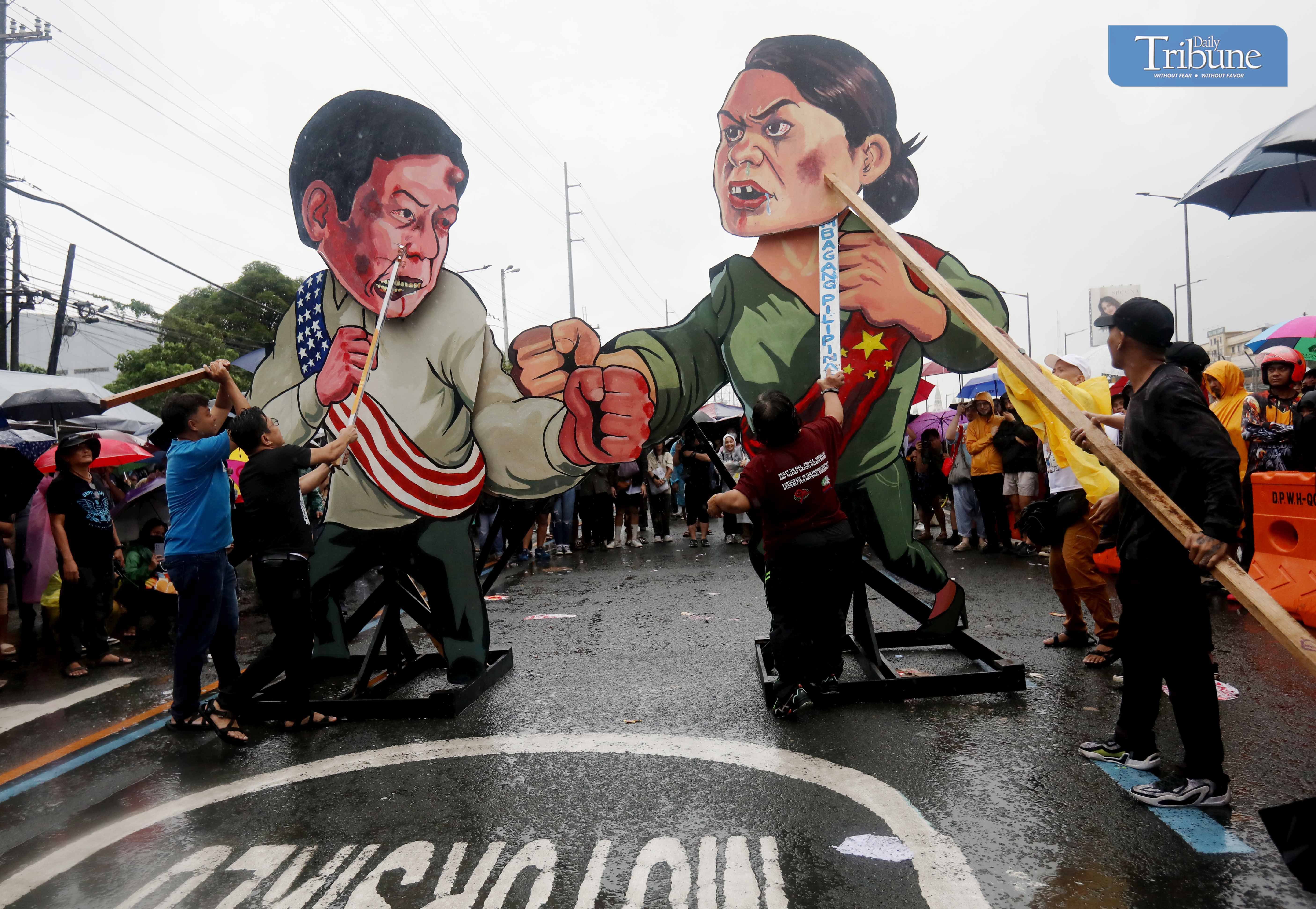 (July 22 2024)………Protesters from various progressive groups destroy an effigy of President Ferdinand R. Marcos Jr. and Vice-President Sara Z. Duterte during the 2024 Peoples SONA on Commonwealth Avenue in Quezon City on July 22, 2024………Photo/Analy Labor