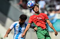 ABDE Ezzalzouli (right) of Morocco goes for a header against the defense of Marco Di Cesare of Argentina during their Group B men’s football match of the Paris Olympics. The Moroccans won, 2-1.