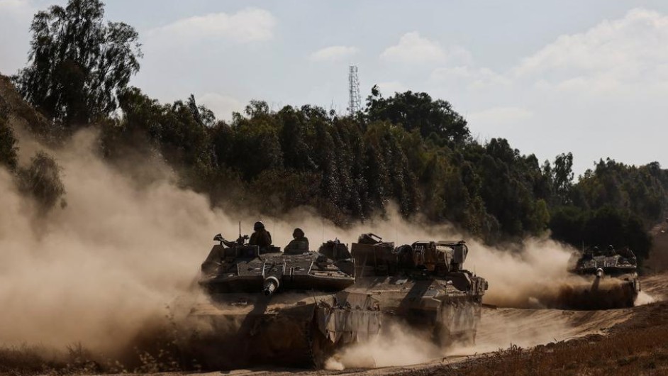 Palestinian militants fire rockets into Israel, tanks advance in Gaza