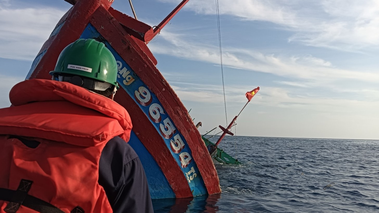 (FILES) Navy Personnel from BRP Ramon Alcaraz (PS16) assesses the sunken Vietnamese vessel with Bow Nr. Q. Ng 96554 TS in Quirino (Jackson) Atoll in the West Philippine Sea on 30 July 2024.