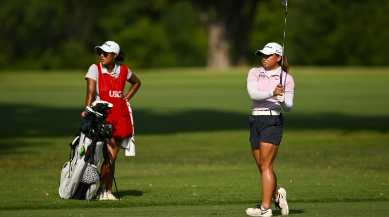 RIANNE Malixi in action with caddie Carmen Fletcher.