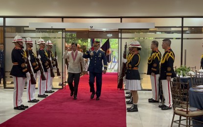 Marcos paints picture of a humane 
PNP force