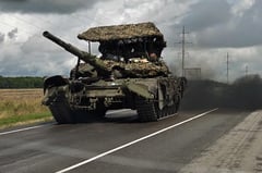 Ukraine presses on with offensive, strikes Russian airfield