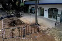 A hole in the street in front of a Banco Macro branch in San Isidro. Argentine authorities discovered an elaborate tunnel built to rob the bank.