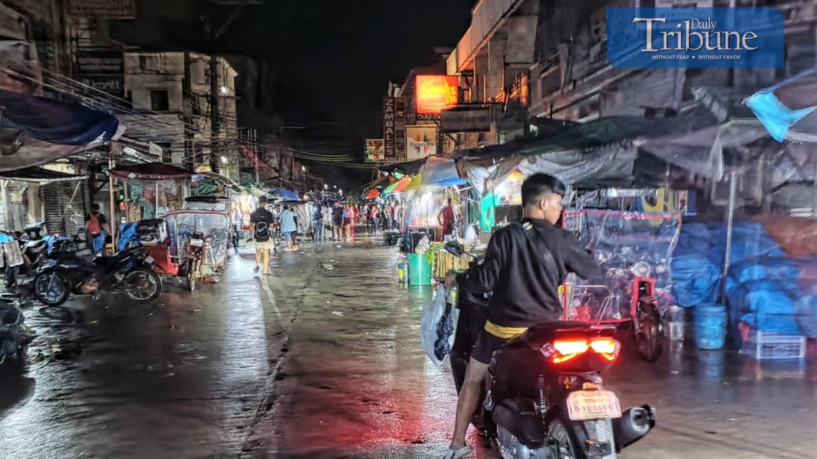City lights sparkle on rain-soaked streets