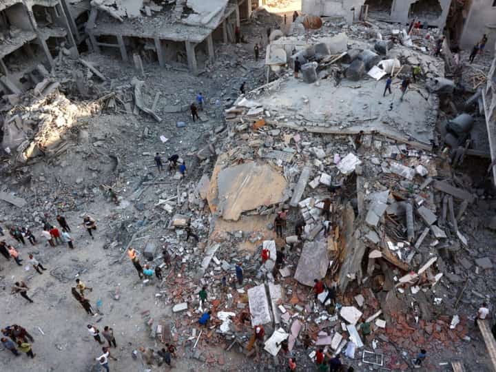 People inspect the damage in Gaza City's Sheikh Radwan neighbourhood after it was destroyed by Israeli bombs on Sunday.