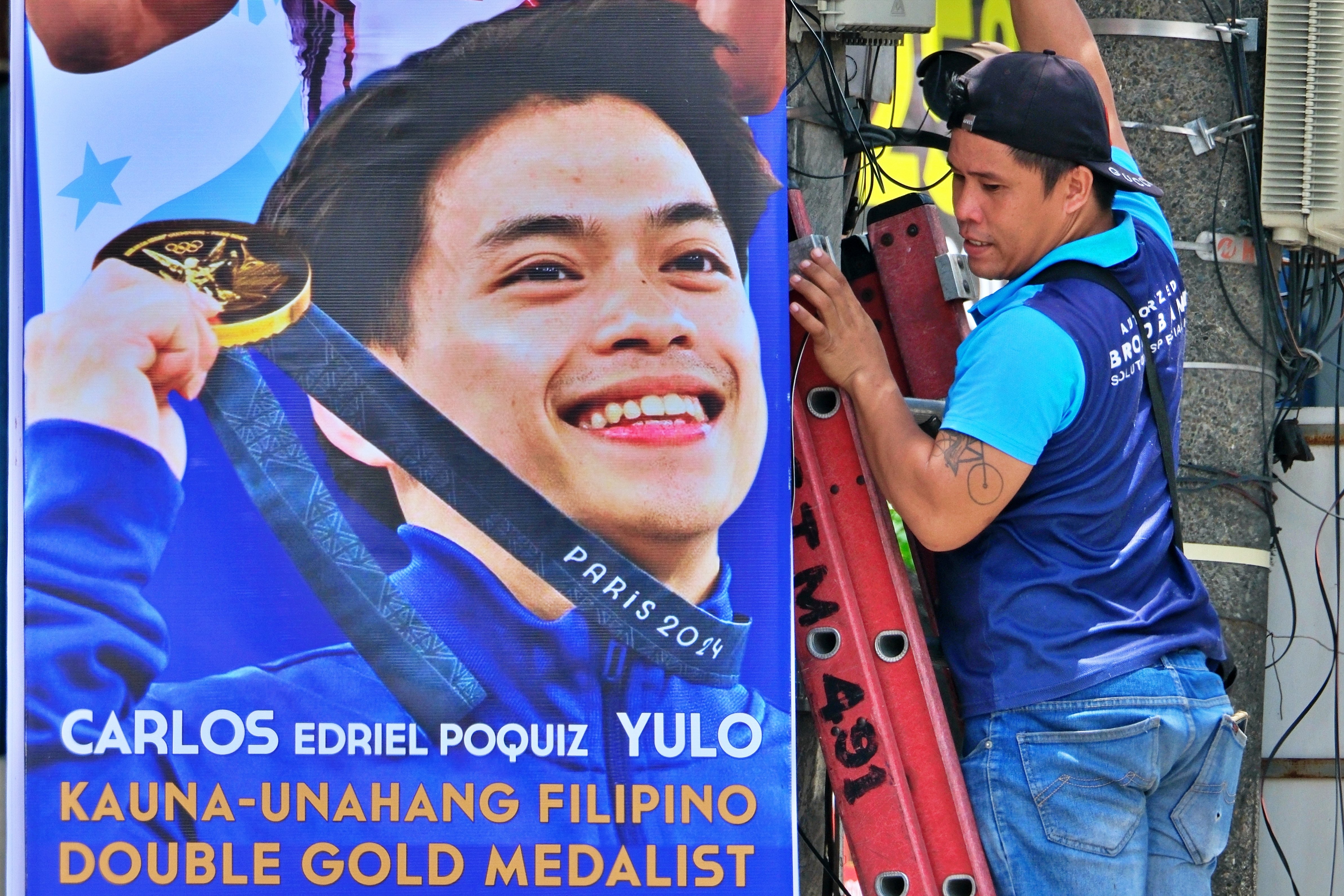 As warm as it gets Printed canvases heralding Olympic two-gold medalist Carlos Yulo sprout all over Manila on Monday, a day before the gymnast and other Filipino campaigners in the Paris Games arrive to a heroes’ welcome.