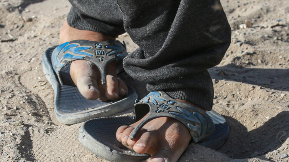 Gazans share shoes, wear same clothes for months
