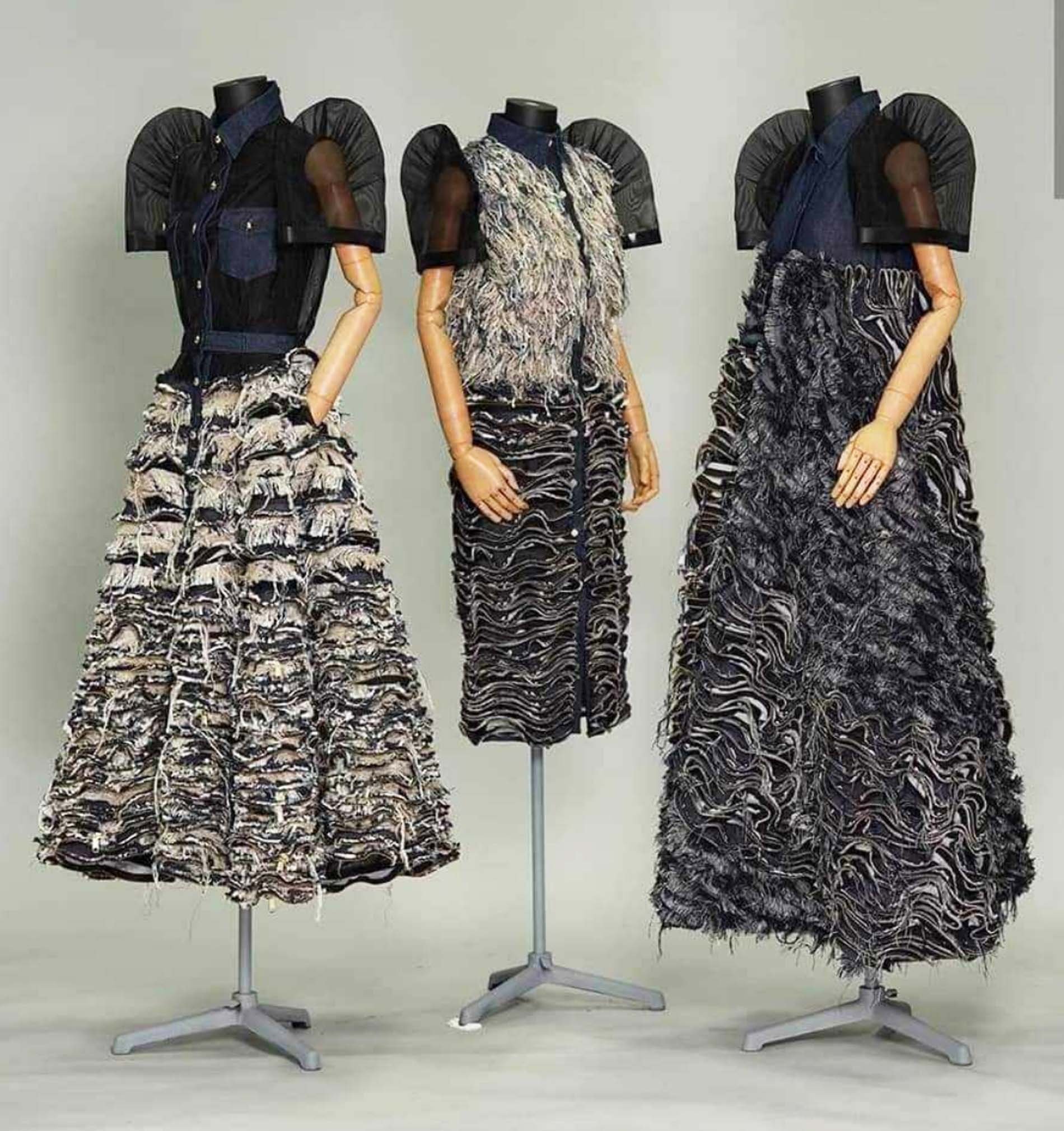 Terno dresses in distressed denim and shredded tweed with brass-toothed zippers as hardware.