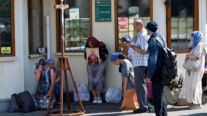 Russia-linked Ukrainian Orthodox Church believers pray in Kyiv