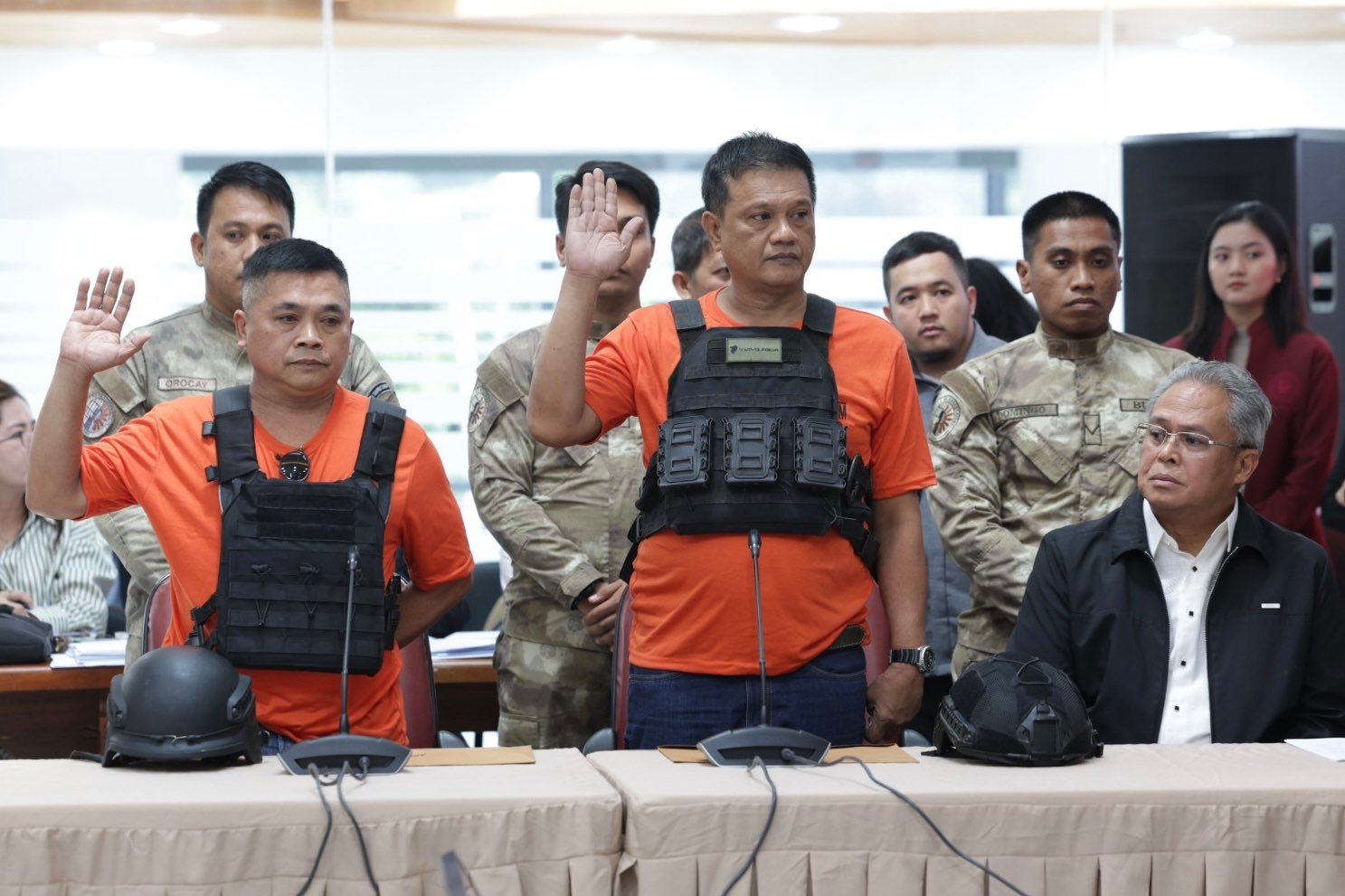 Persons deprived of liberty Fernando Magdadaro (left) and Leopoldo Untalan Tan Jr. testify before the House quad comm on Thursday.