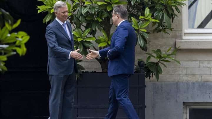 Belgium's King Philippe greets N-VA president Bart De Wever (right) before a meeting in Brussels, on 10 July 2024.