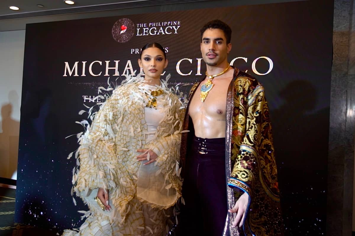 Models Rina Maier and Kirk Bondad wearing Michael Cinco.