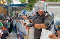 (FILE PHOTO) MEMBERS of the Kingdom of Jesus Christ barricade CP Garcia Highway in Davao City in an effort to stop the police from arresting their leader, Pastor Apollo Quiboloy, believed holed up in their sprawling headquarters.