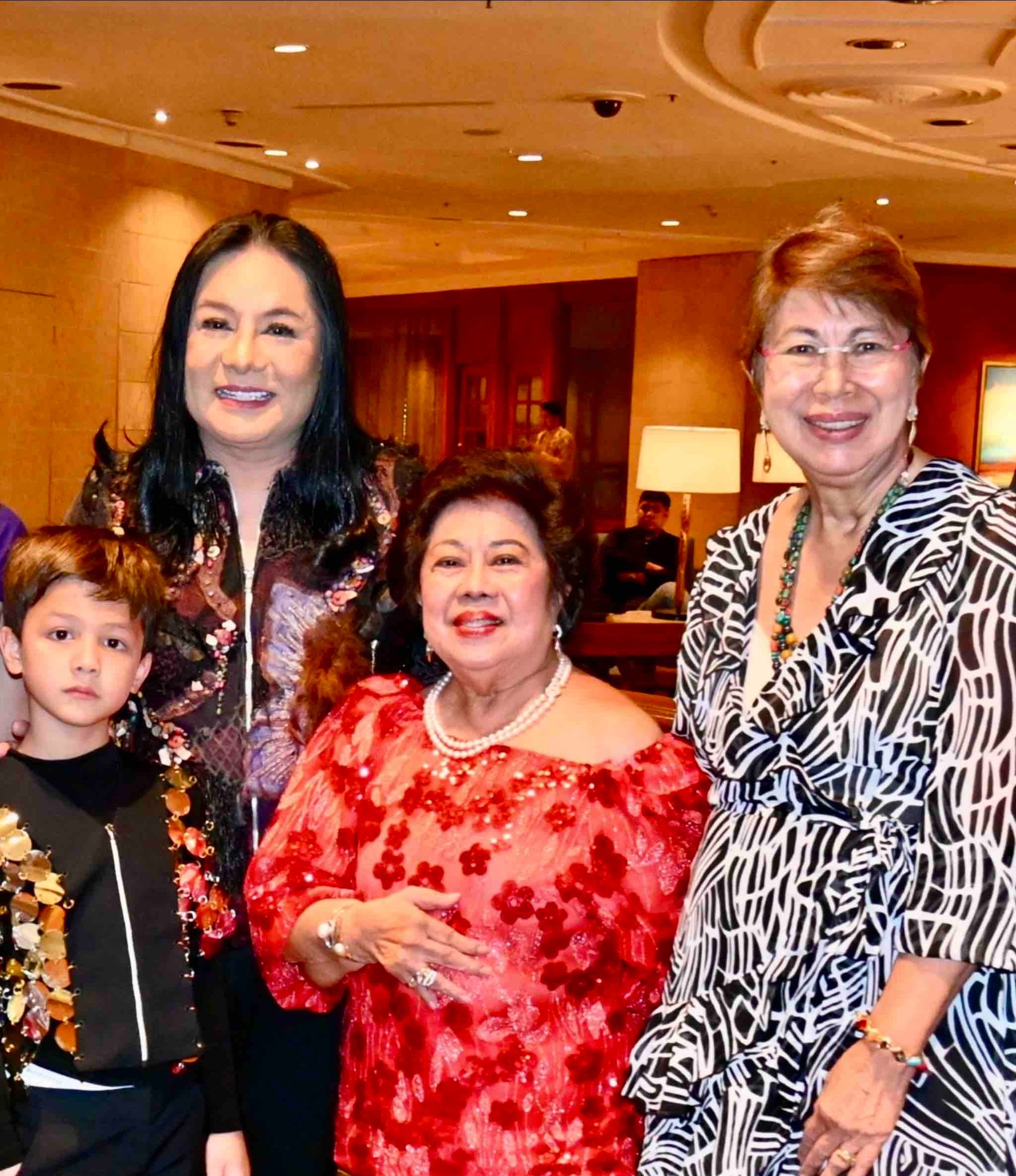 Joel Cruz and his son, Lulu Boon and Roselle Rebano.
