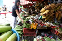 (FILES) Customers are seen buying vegetables at Tandangsora Market in Quezon City, on Sunday, 14 July 2024, according to a new survey conducted by Pulse Asia Research in June, a month ahead of the president's third State of the Nation Address.