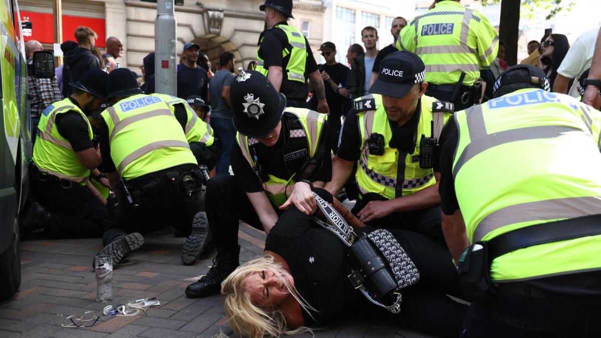 Far-right protesters clash with police as UK unrest spreads
