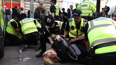 Far-right protesters clash with police as UK unrest spreads