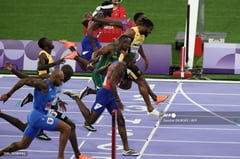 Lyles tops 100m run in dramatic fashion