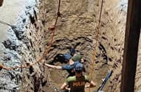 Police inside excavated tunnel