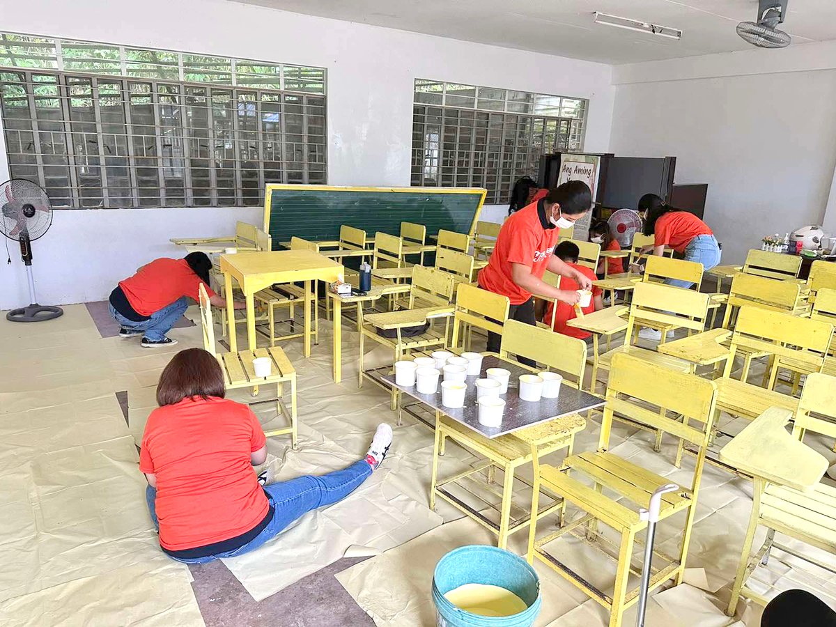 SPIRIT OF BAYANIHAN. Meralco employee-volunteers repainted school chairs at Alas-Asin Elementary School in Tanay, Rizal.