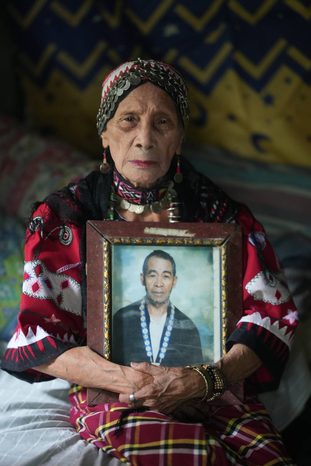 Federico Caballero’s wife Lucia holding his portrait during a funerary ritual on 1 September.