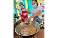 Members of the Gamot, Luya, Dalogo Farmers Association in Polangui, Albay cook pili nuts during their research and development training.
