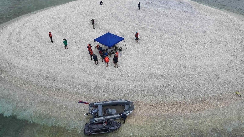 Phl says 'we have not lost' South China Sea reef after pullout