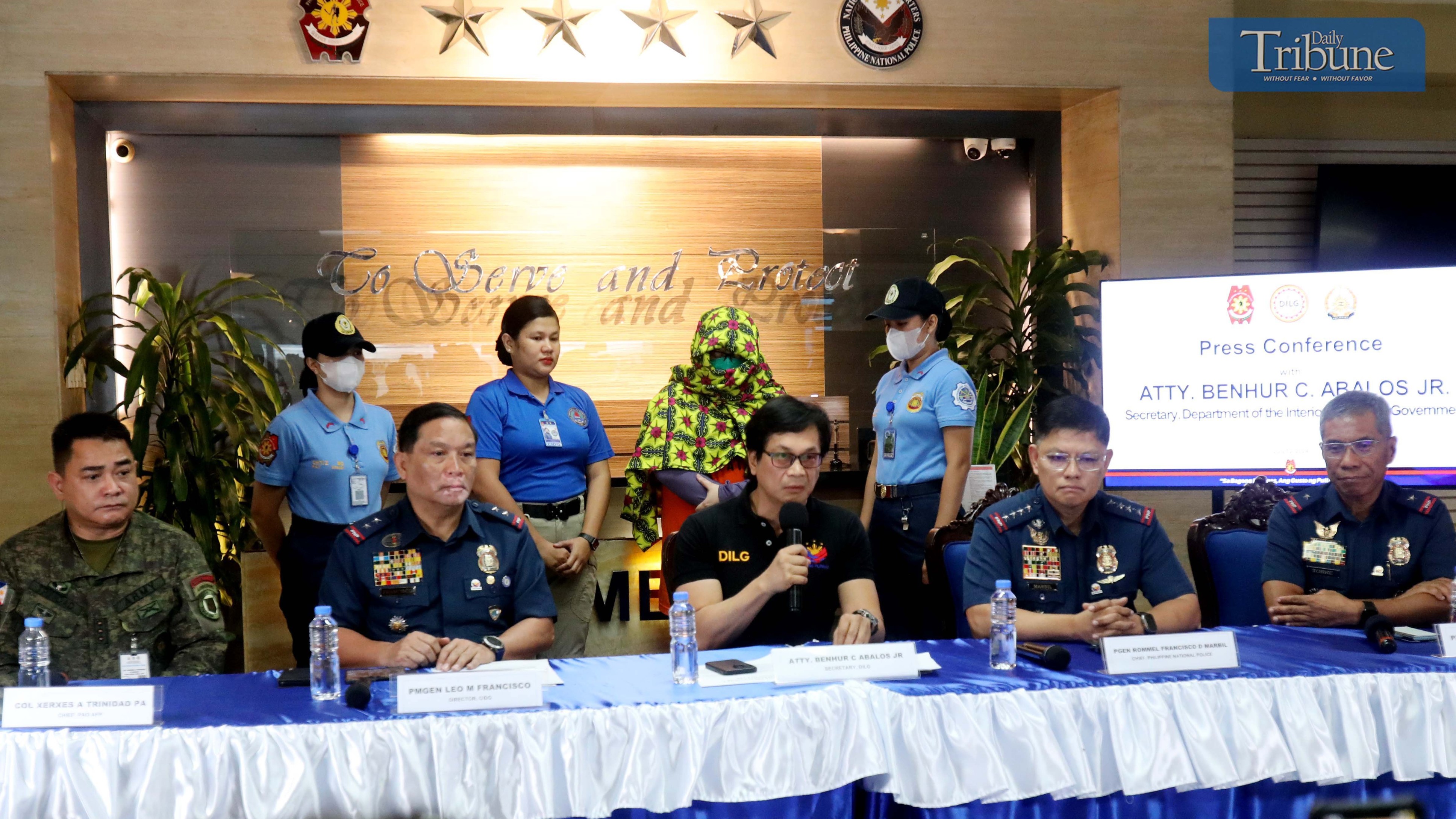 [FILE] DILG Secretary Benhur Abalos introduces to the media Paulene Canada, a co-accused of Kingdom of Jesus Christ founder Pastor Apollo Quiboloy, along with PNP Chief Dir. Gen. Rommel Francisco Marbil and CIDG Chief Leo Francisco, with Davao Region Police Director PBGen Nicolas Torre, at the PNP Headquarters in Camp Crame, Quezon City, on Friday July 12, 2024. Canada has a bounty on her head worth P1 million and is the No. 6 most wanted in the Davao region.………..Photo/Analy Labor