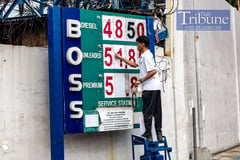 Hefty fuel price cuts kick in, but global oil risks linger
