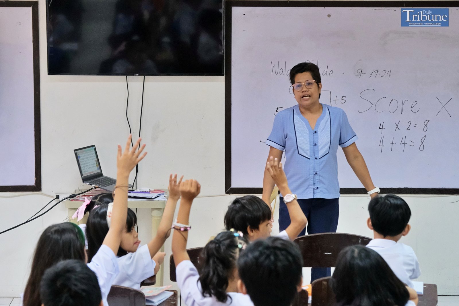 Teacher with pupils in classroom