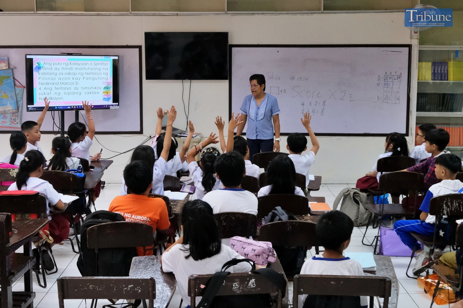 Teacher with pupils in classroom