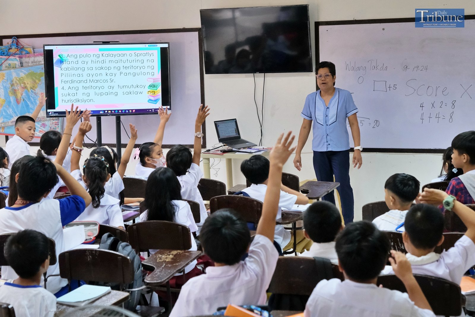 Teacher with pupils in classroom