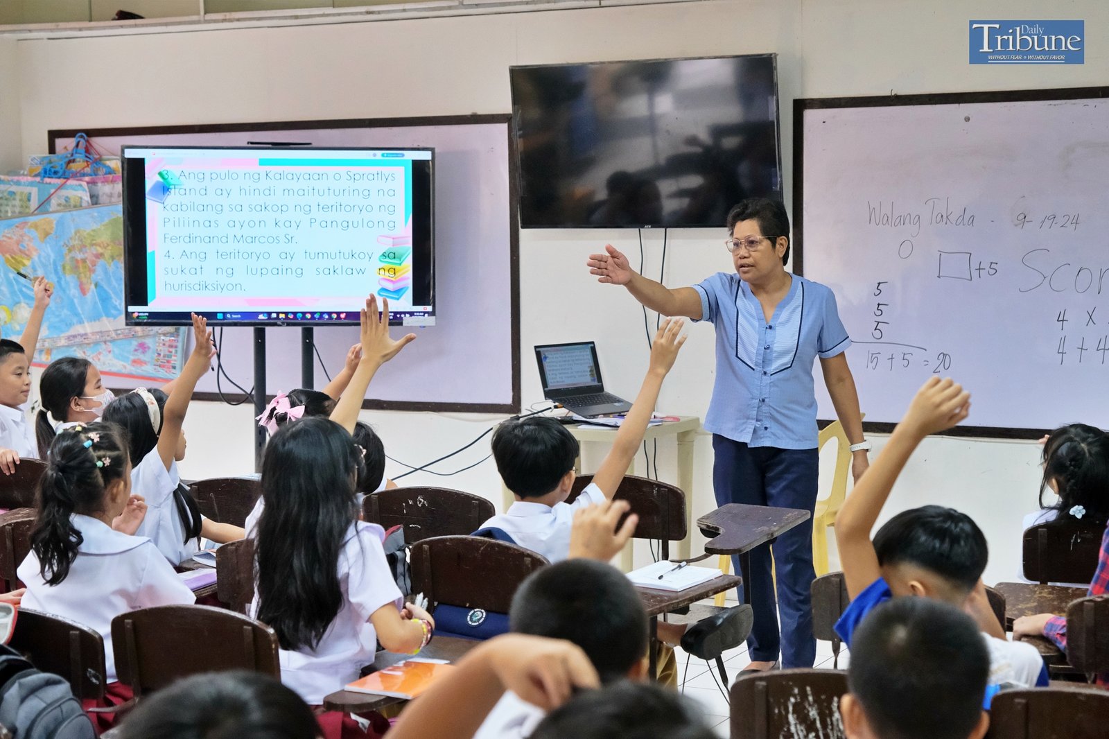 Teacher with pupils in classroom